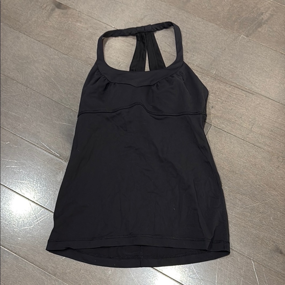 Lululemon Black Halter Top no tags or pads, I believe size 6.  Good condition
